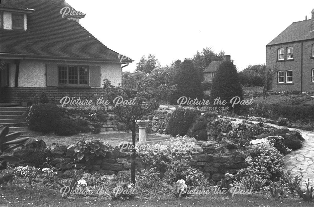 Photograph of a Stanton house with a garden (which overlooks the Nutbrook Valley and Stanton Works)