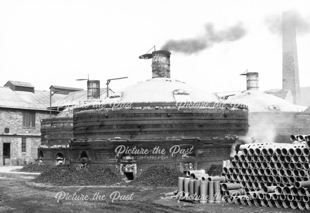 Round down-draught kilns at the brick and sanitary pipe works of W H and J Slater, Denby