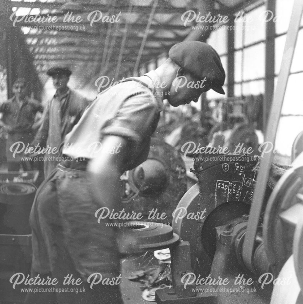 Qualcast lawn mower works, Victory Road - a worker fettling a brake drum