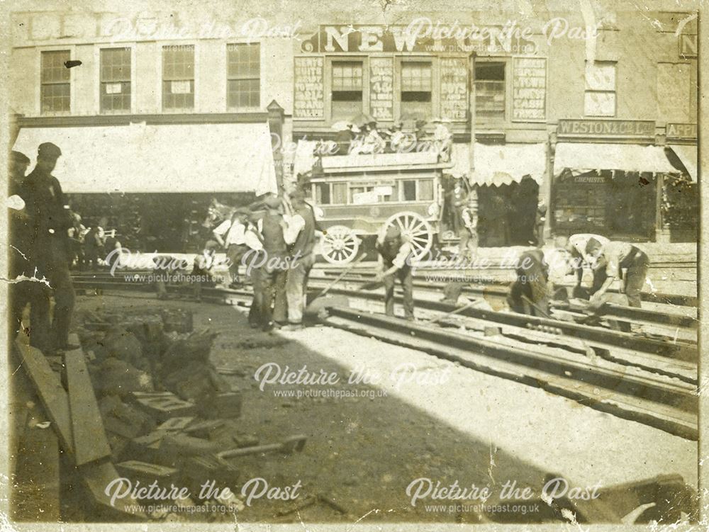 Laying tramway track, and a horse bus, at the junction of Babington Lane and St Peter's Street