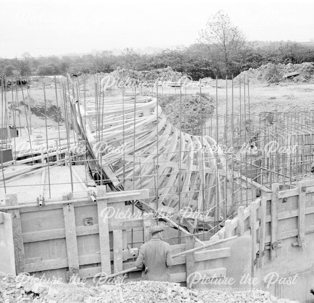 Construction of Ore Preparation Plant - steel framework at the base of the plant's chimney