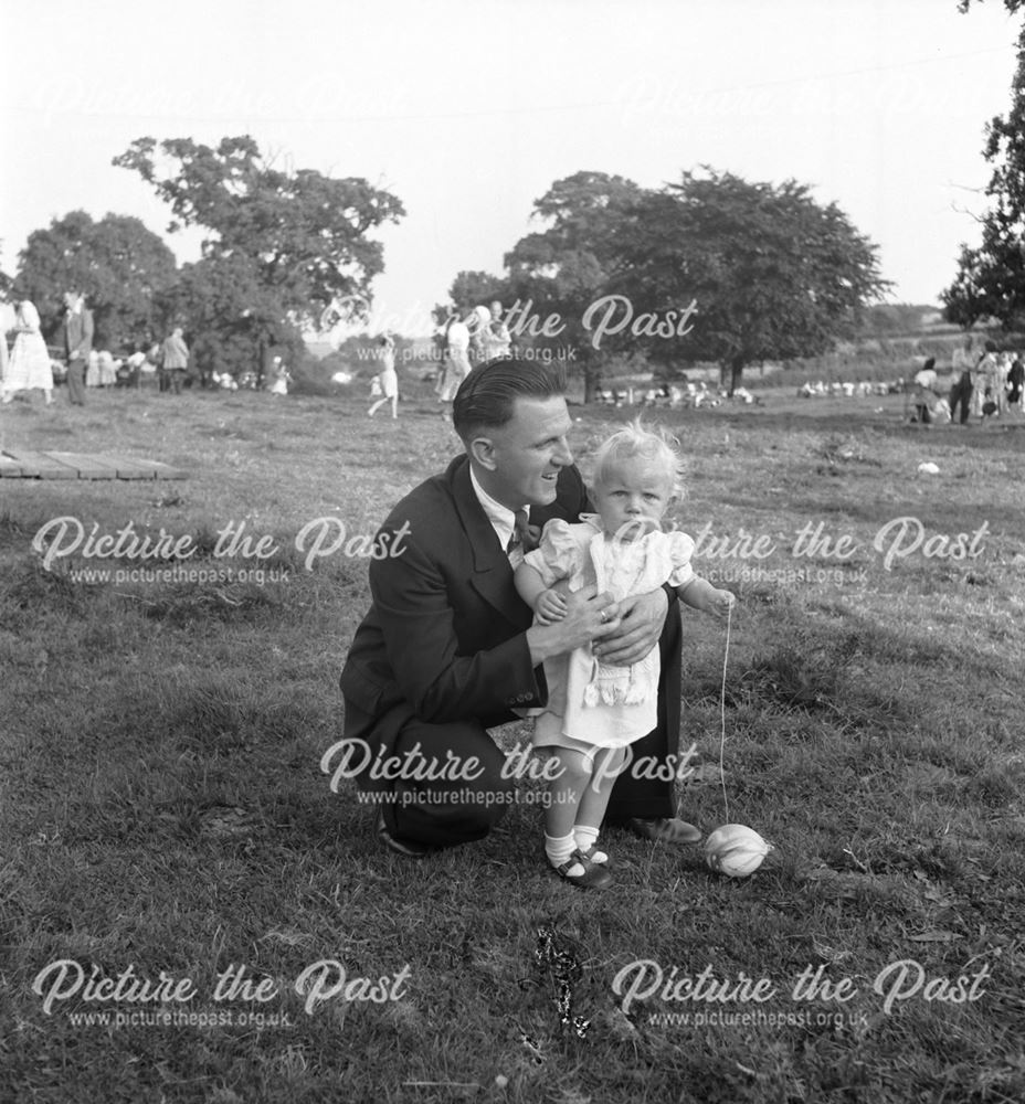 A man and toddler at a Stanton Works Annual Flower Show