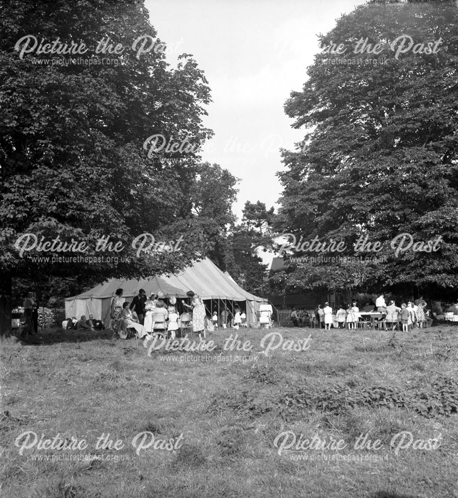 A marquee among the trees at a Stanton Works Annual Flower Show