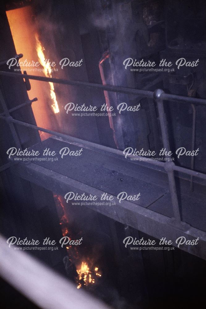 Door being removed from the front of an oven - Coke Oven Plant, Stanton Works