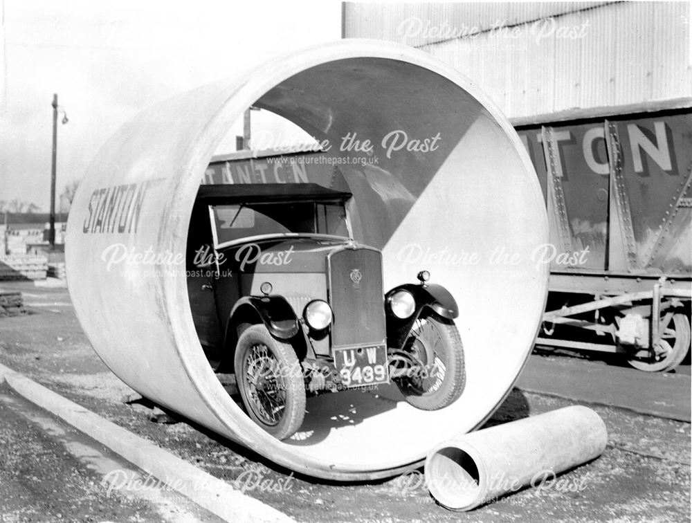 Motor car inside a concrete pipe