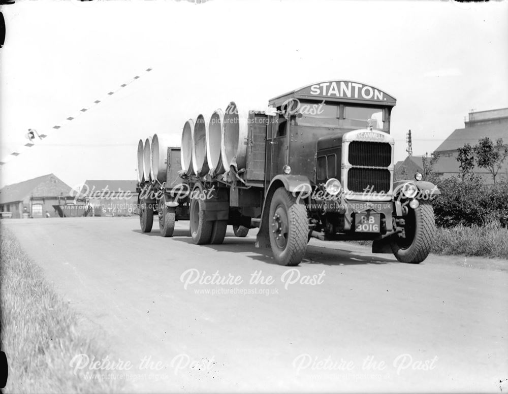 Scammell lorry and trailer loaded with concrete pipes