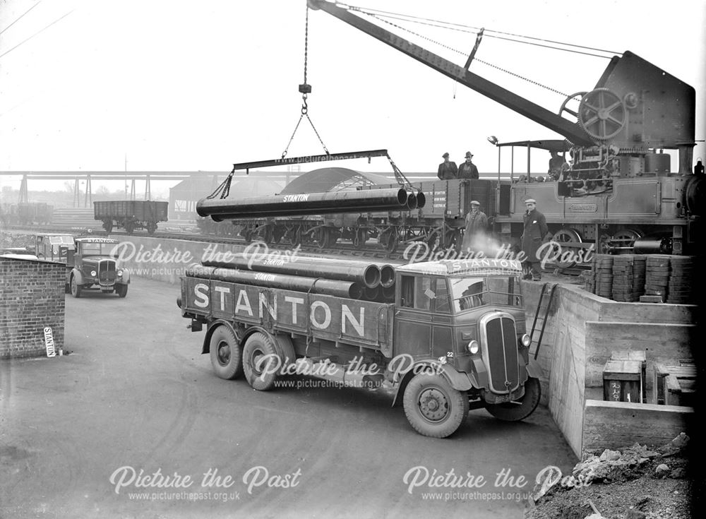 Loading pipes into a lorry at Spun Pipe Plant Loading Stage