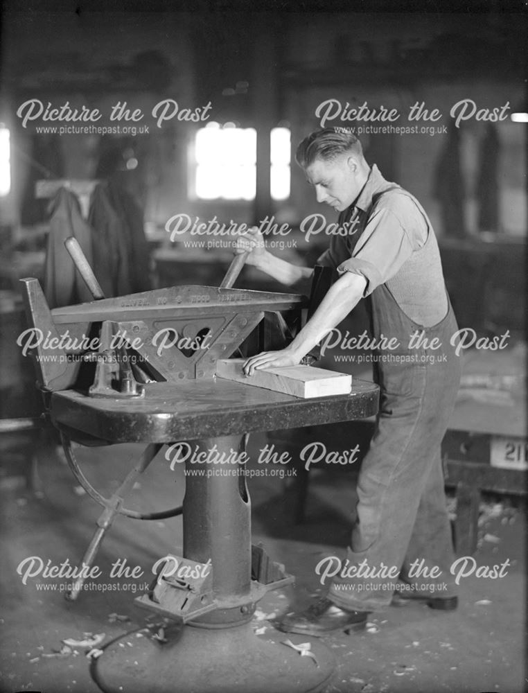 Employee using a wood trimmer at Riddings Foundry