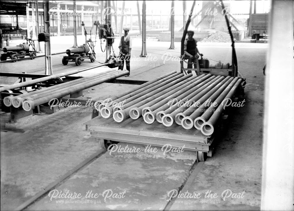 Electric transfer car loaded with spun iron pipes