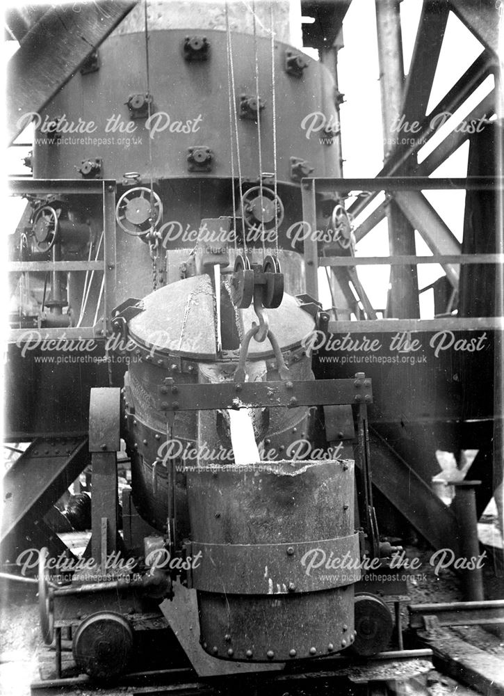 Pouring molten iron from a cupola at the Nutbrook Spun Plant