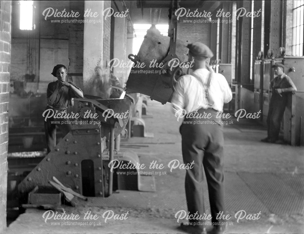 Pouring molten metal into a pipe spinning machine at the Nutbrook Spun Plant