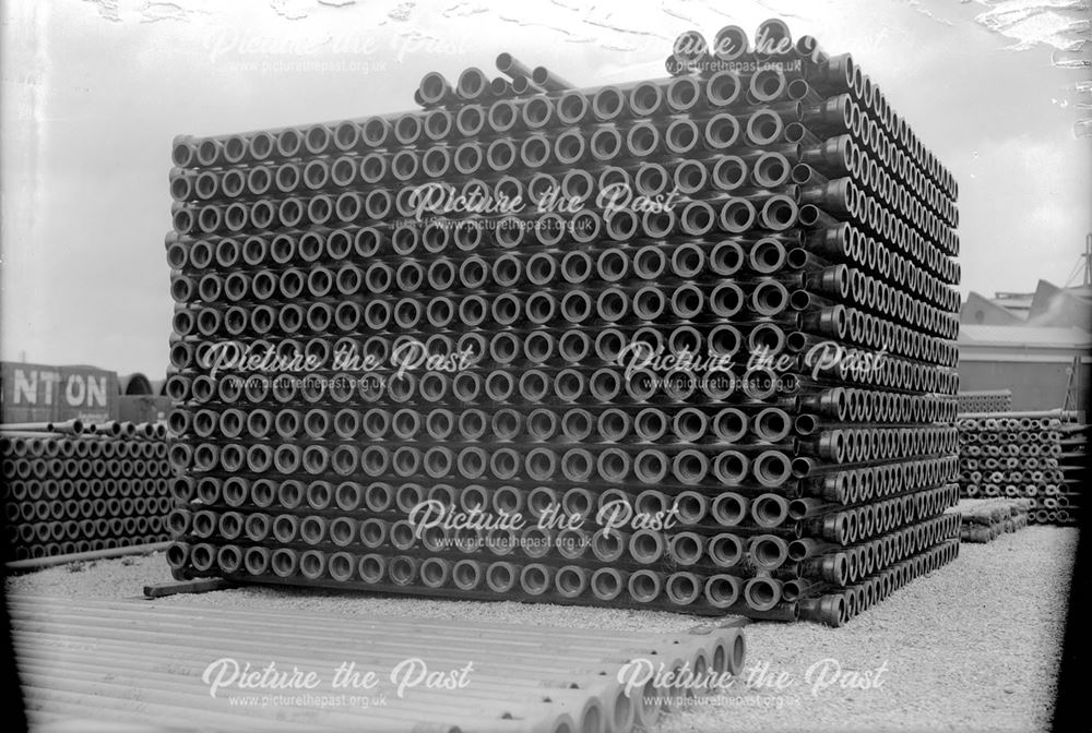 Stack of spun iron pipes