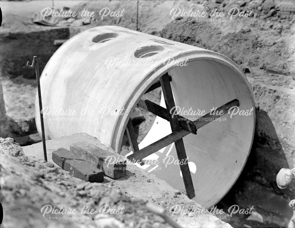 Constructing am air raid shelter using large diameter concrete pipes