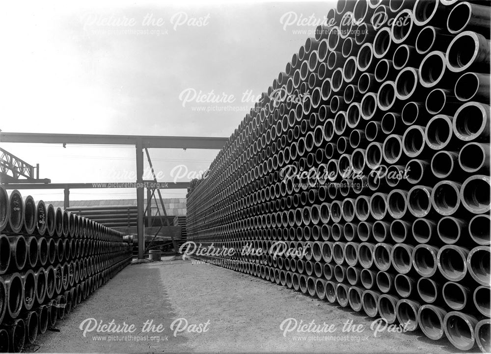 Stacks of spun iron pipes