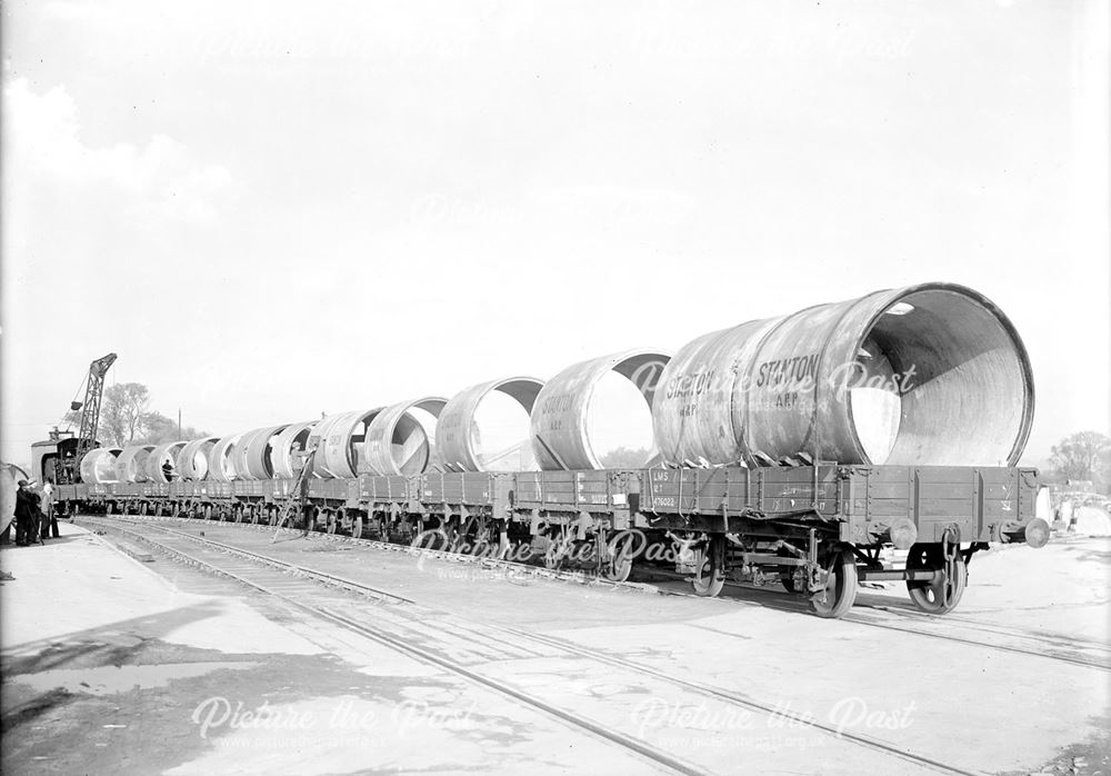 Train carrying cylindrical concrete air raid shelters, 1939