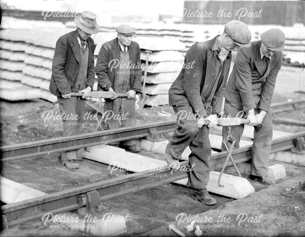 Installing a concrete railway sleeper, 1943