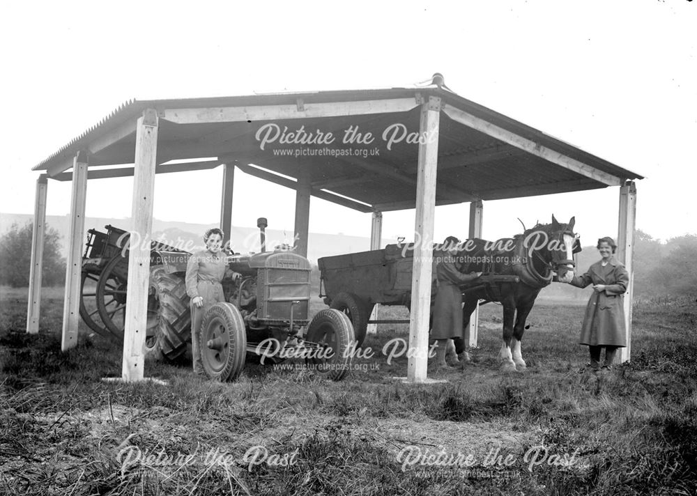 Concrete farm shelter and female workers, 1943