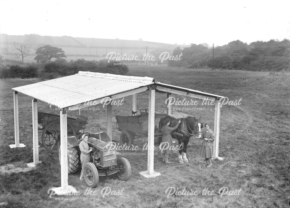 Concrete farm building and female workers, 1943