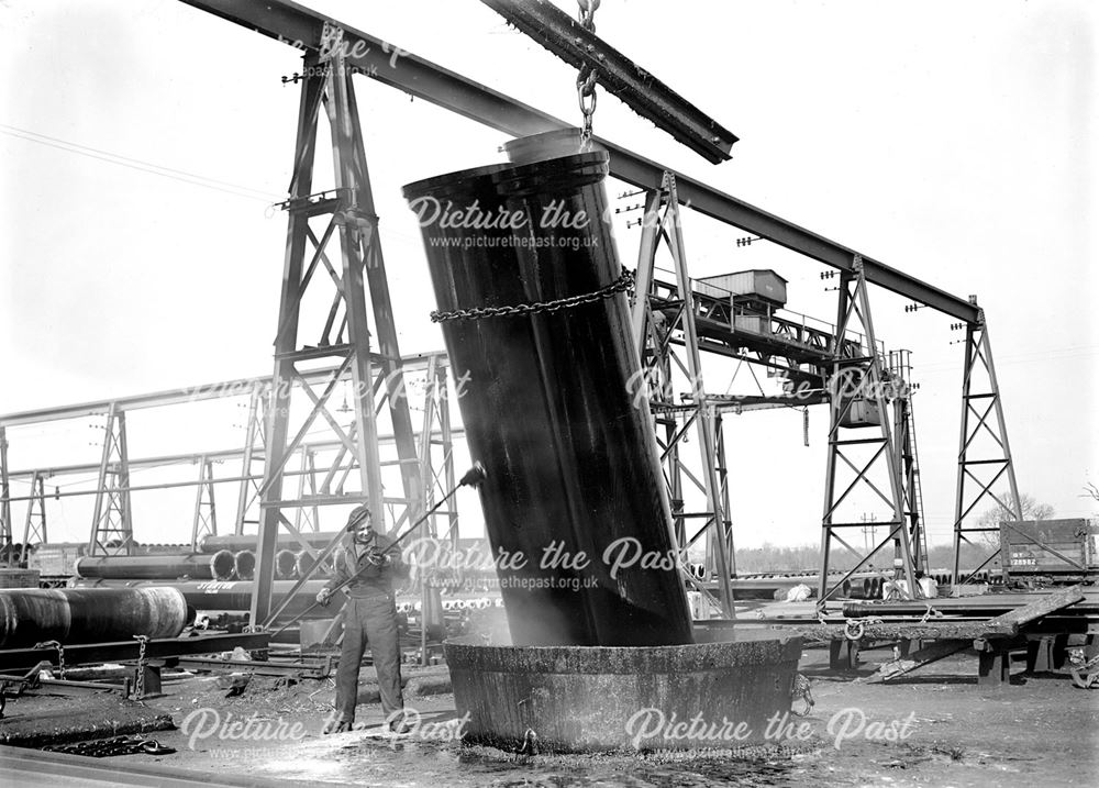 Dipping Iron Pipes in Bitumen tank, Dale Plant, Stanton Works, c 1948