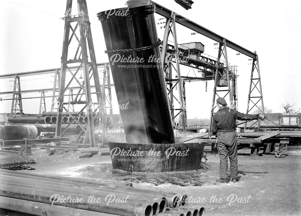 Dipping Iron Pipes in Bitumen Tank, Dale Plant, Stanton Works, c 1948