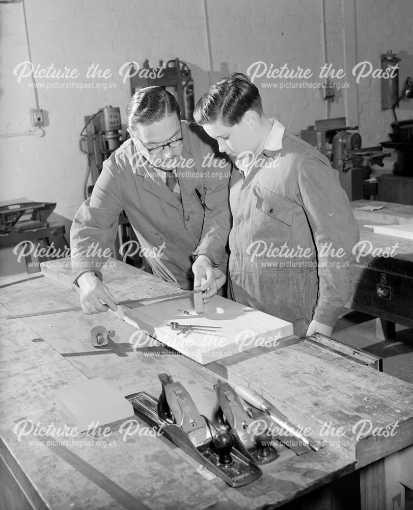 George Tyres, woodwork instructor and apprentice in training centre, c 1955