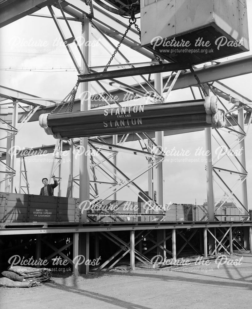 Stanton Stock Yard, spun iron pipes being loaded, c 1960's