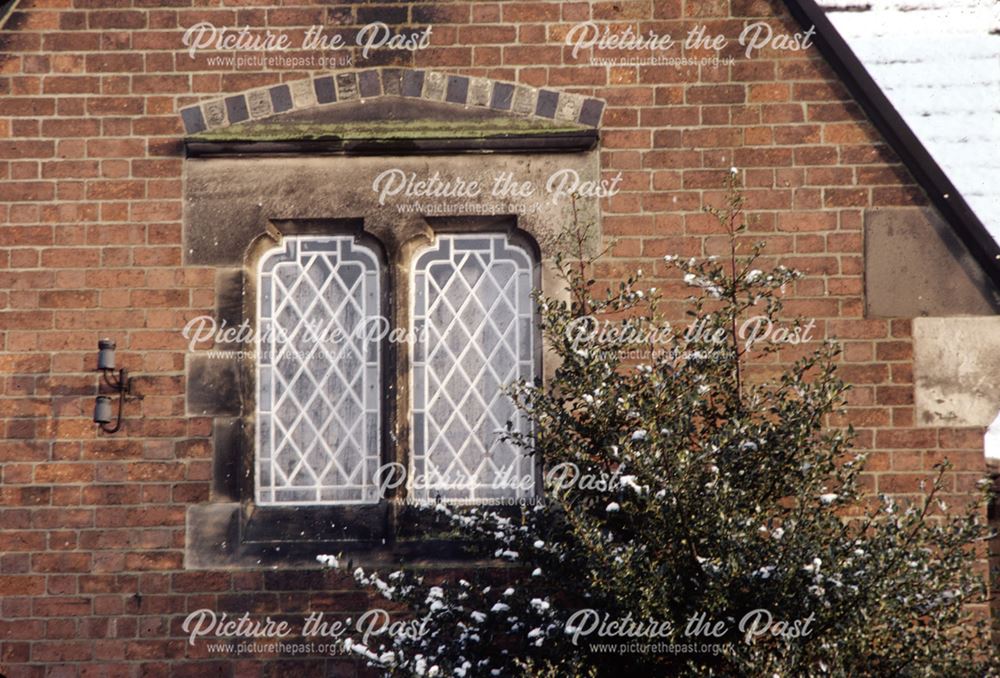 Detail of lead mullion windows with stone reveals and tracery set into the gable - Alvaston School