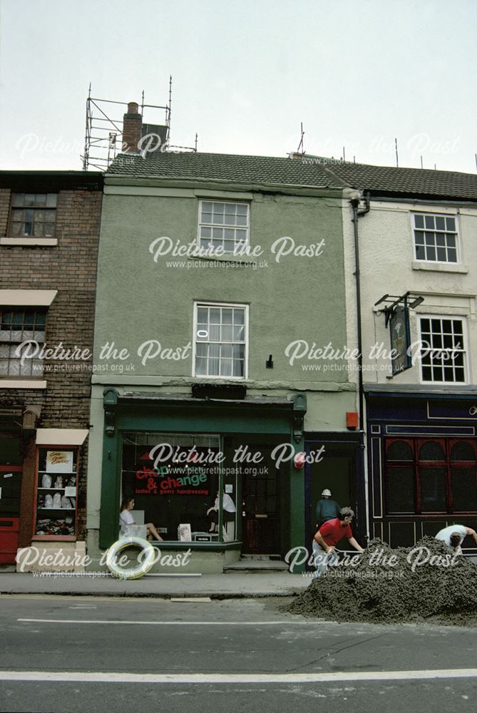 Georgian terrace of shops adjacent to The Buck in the Park public house