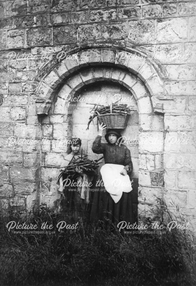 Stick gatherers beside the Norman Arch, Littleover Church