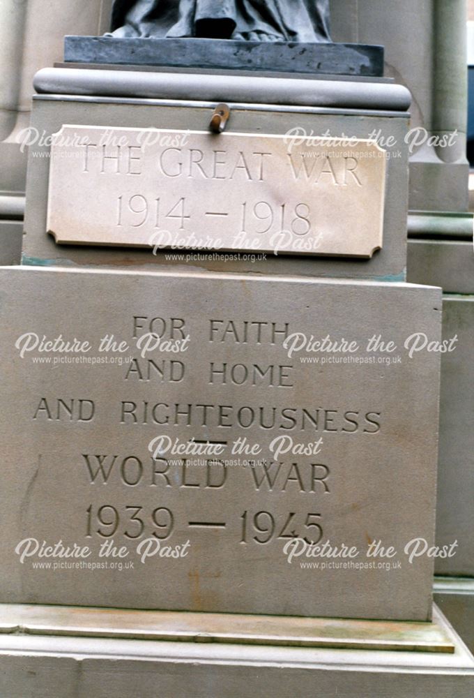 War memorial plaque at base of statue for WW1 and WW2