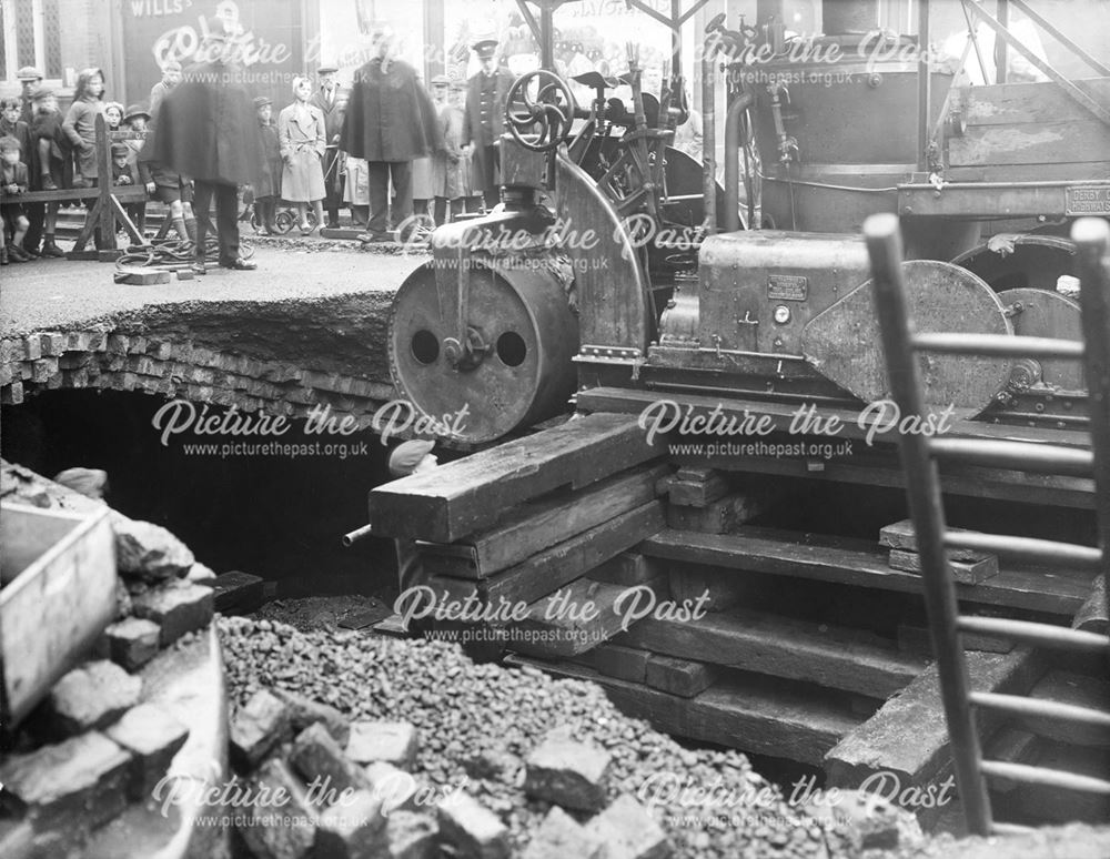 Steam Roller being rescued after the road collapsed