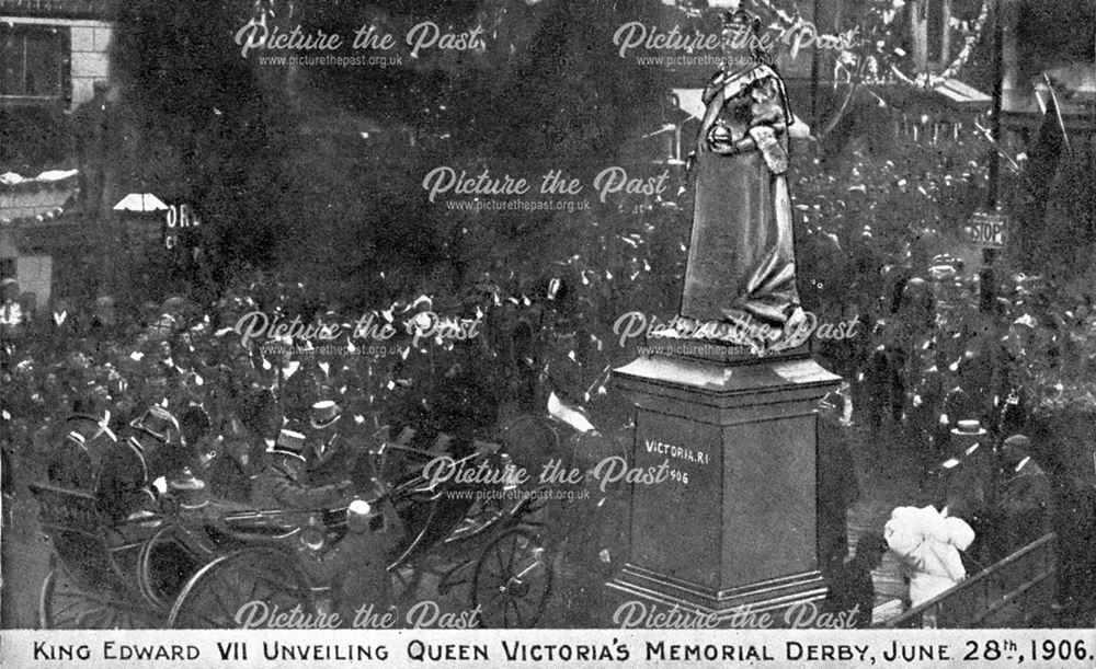 Crowds and King Edward VII watch the unveiling of the statue of Queen Victoria