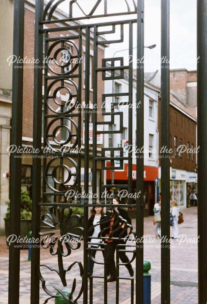 Wrought metal sculptured archway-structure on the Cornmarket