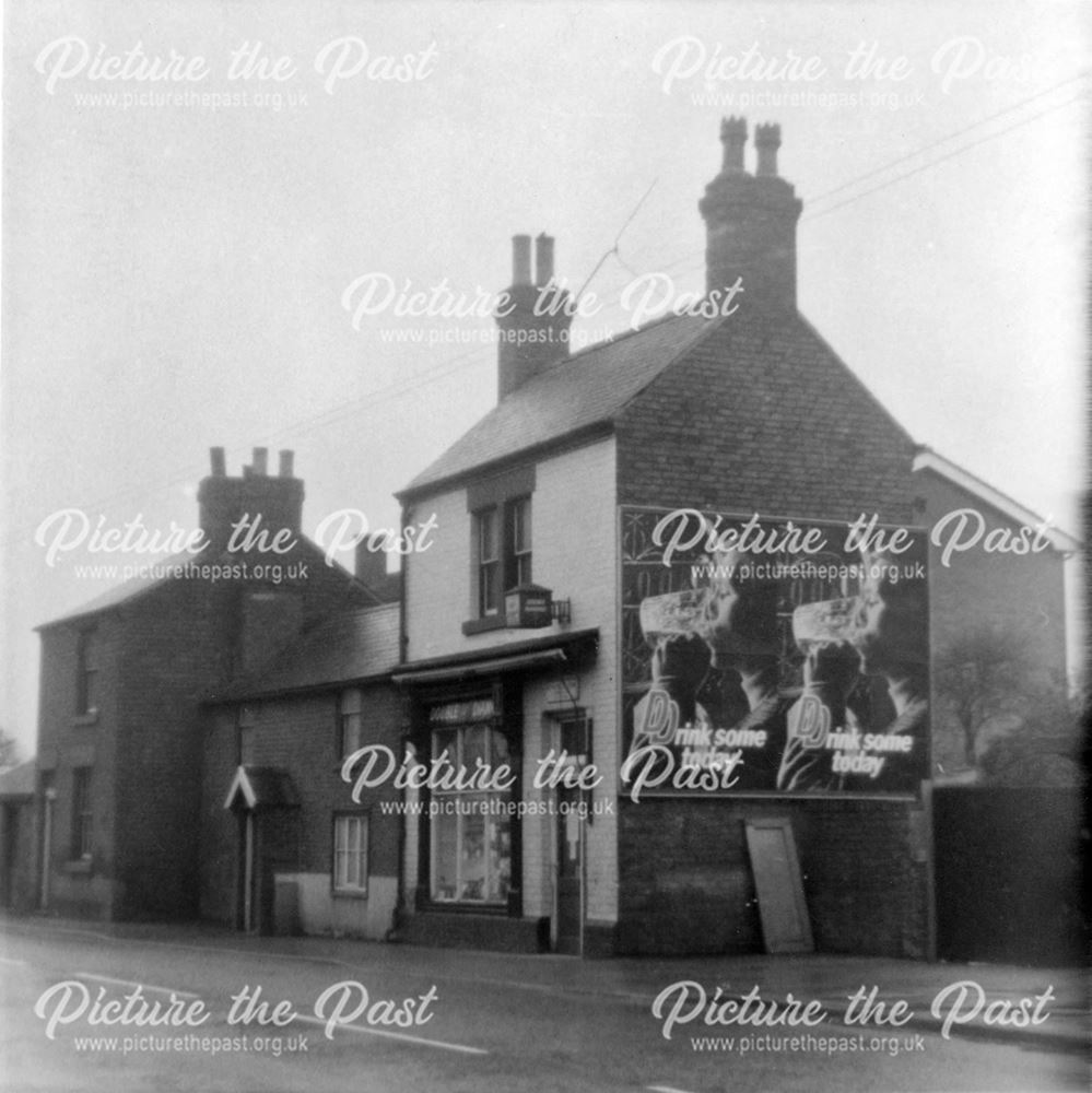 Houses and Off-licence in the village centre, Burton Road, Littleover