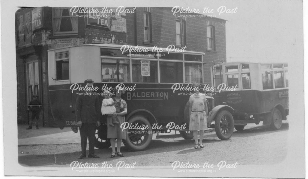 Buses outside Tollertons shop in Coronation Street. 