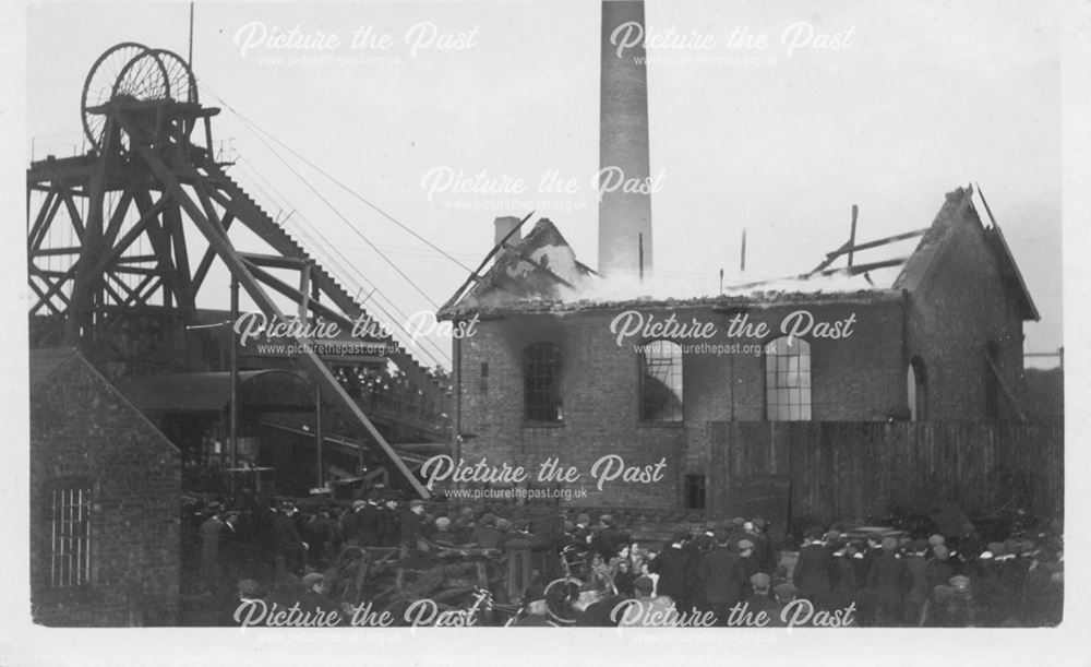 Headstocks and winding house fire with crowd