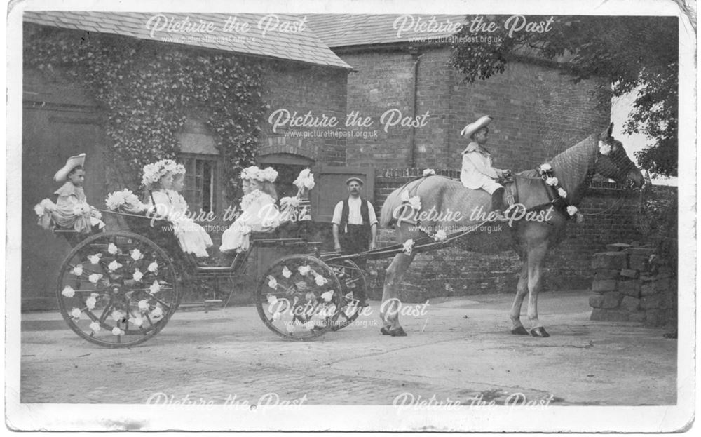 Decorated horse and cart with children