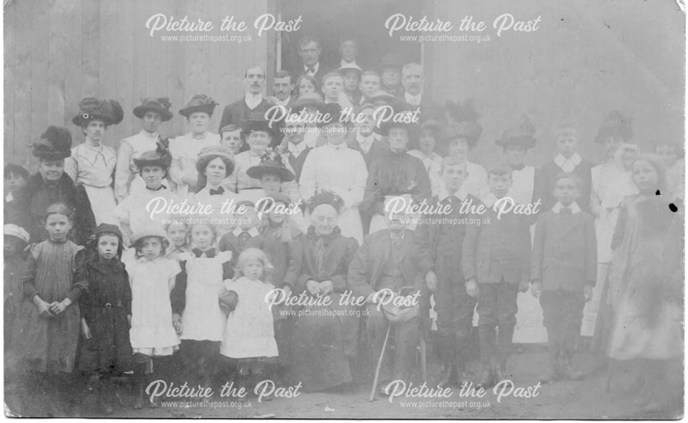 Posed group of children and adults