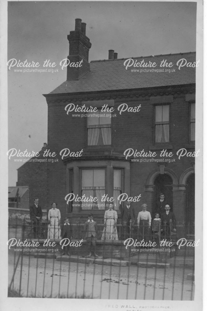 Unidentified house with family group