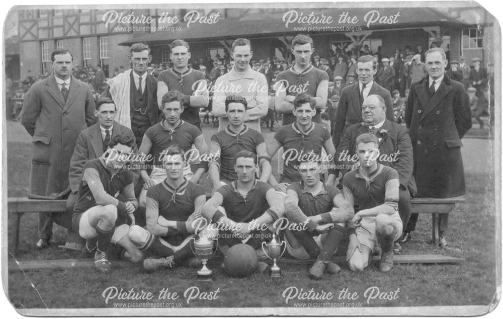 Football team with trophies.