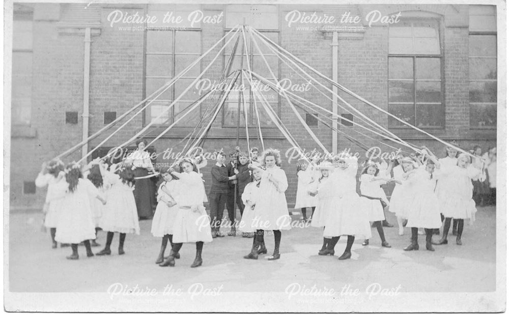 Dancing around a may pole