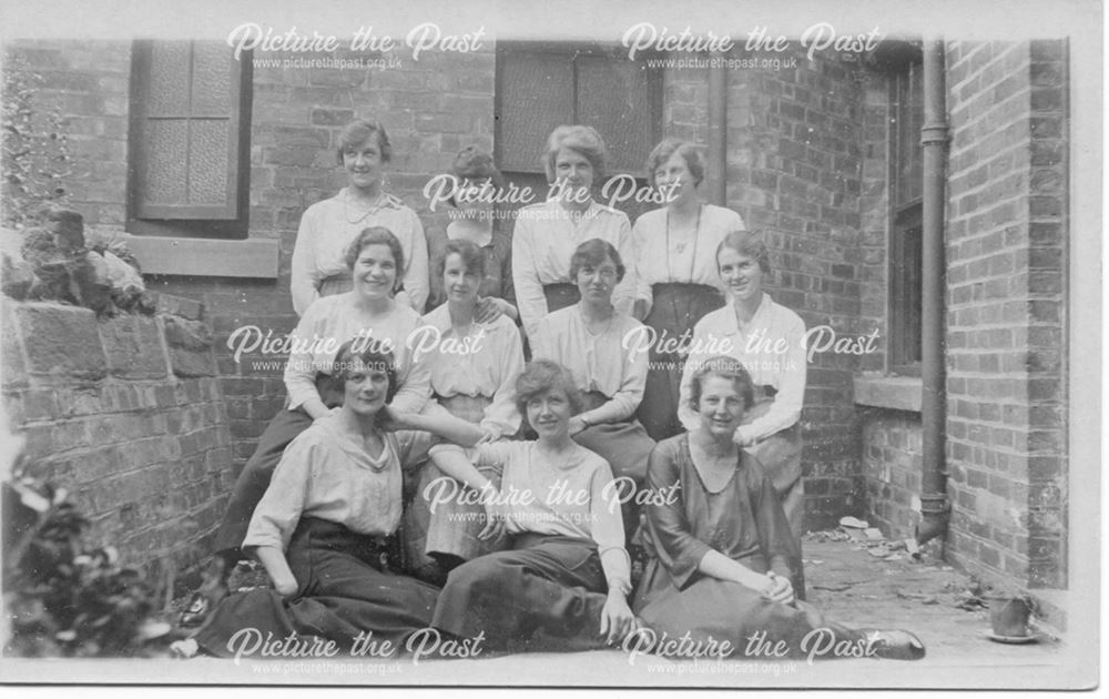 Posed women in back yard