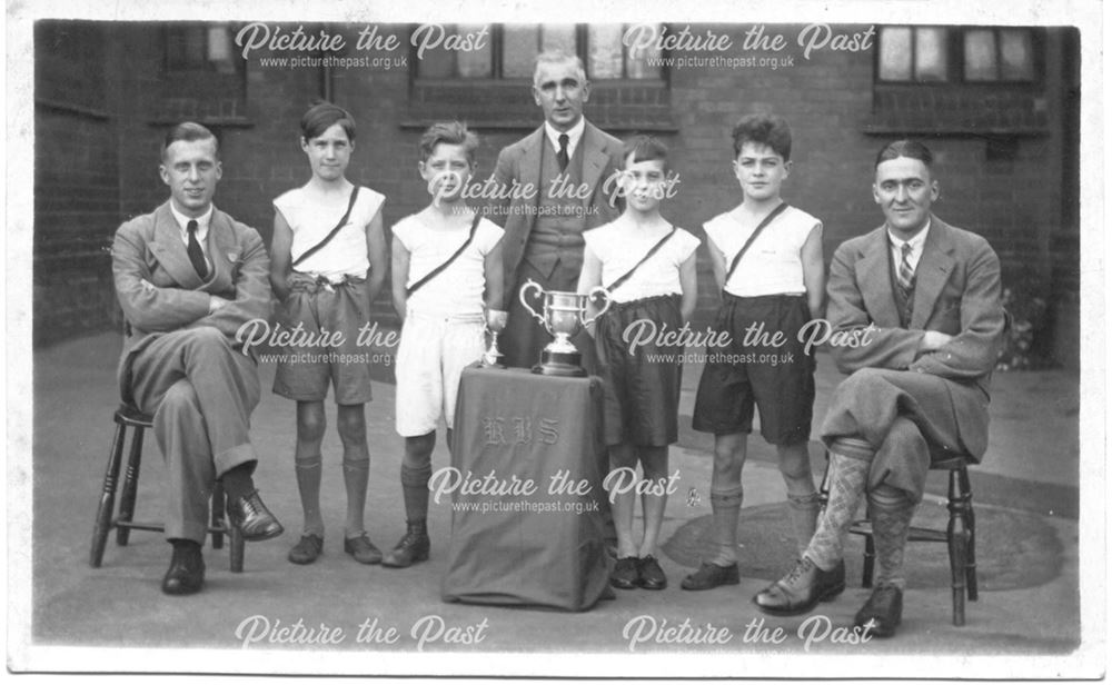 Boys athletics club (?) with trophies