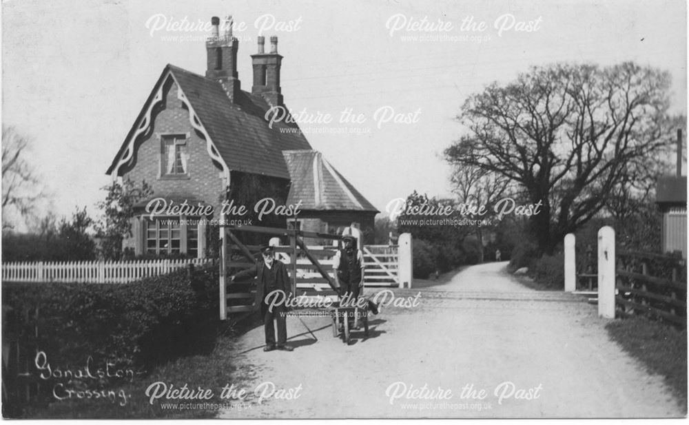 Railway worker and workman with wheelbarrow