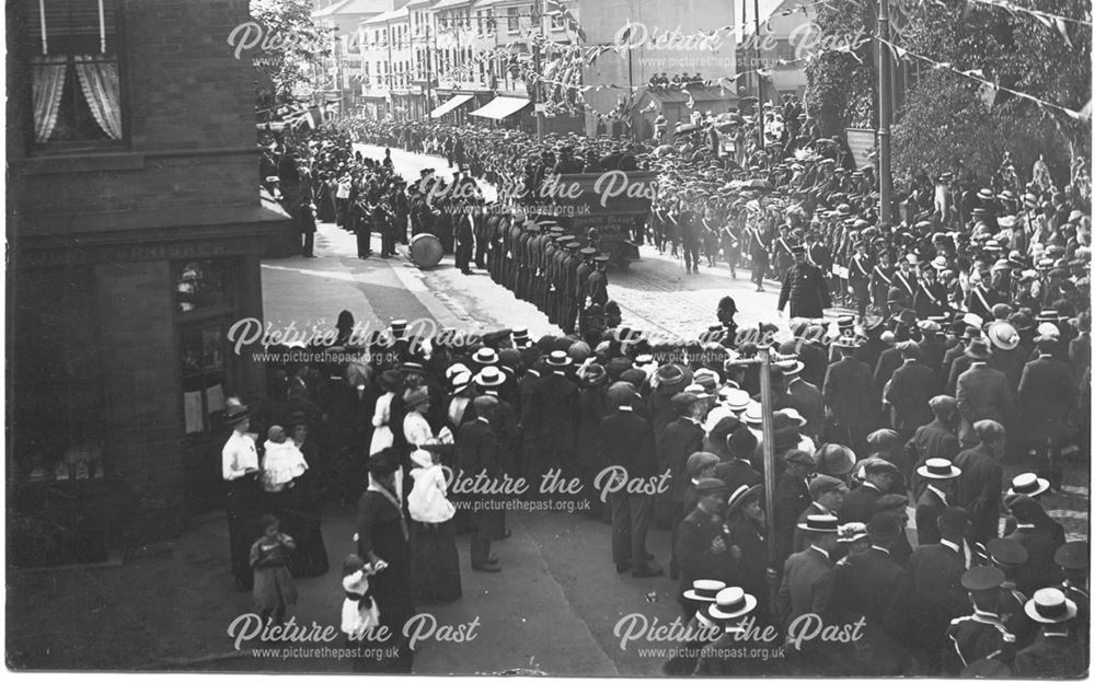 Crowd celebrations with police and bands