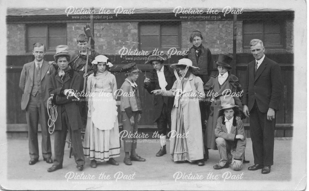 Group of people costumed for performance