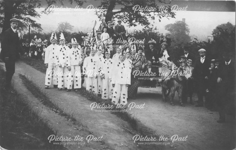 Clowns in a parade. With cart pulled by shetland pony