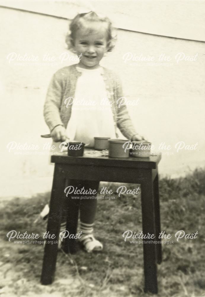 Little Girl Standing at a Table, c 1930s-40s