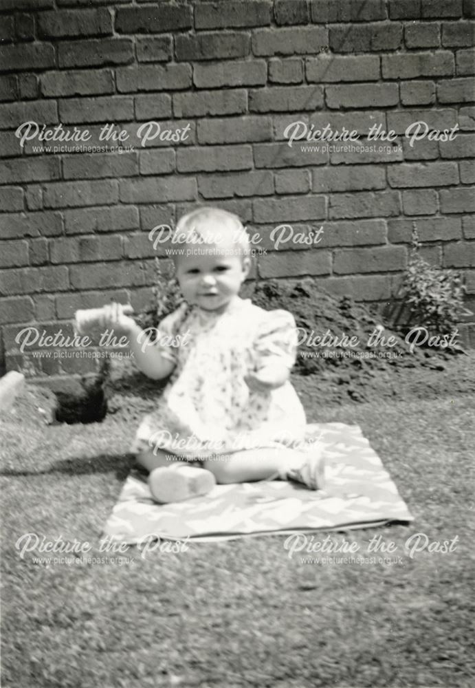 Baby eating an Ice Cream in the Garden, c 1930s-40s