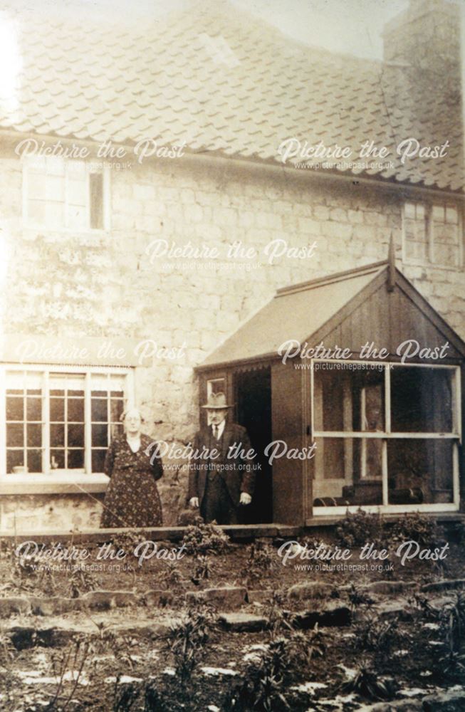 The Miller and his wife outside their cottage, Mill Lane, Whitwell, c 1930's